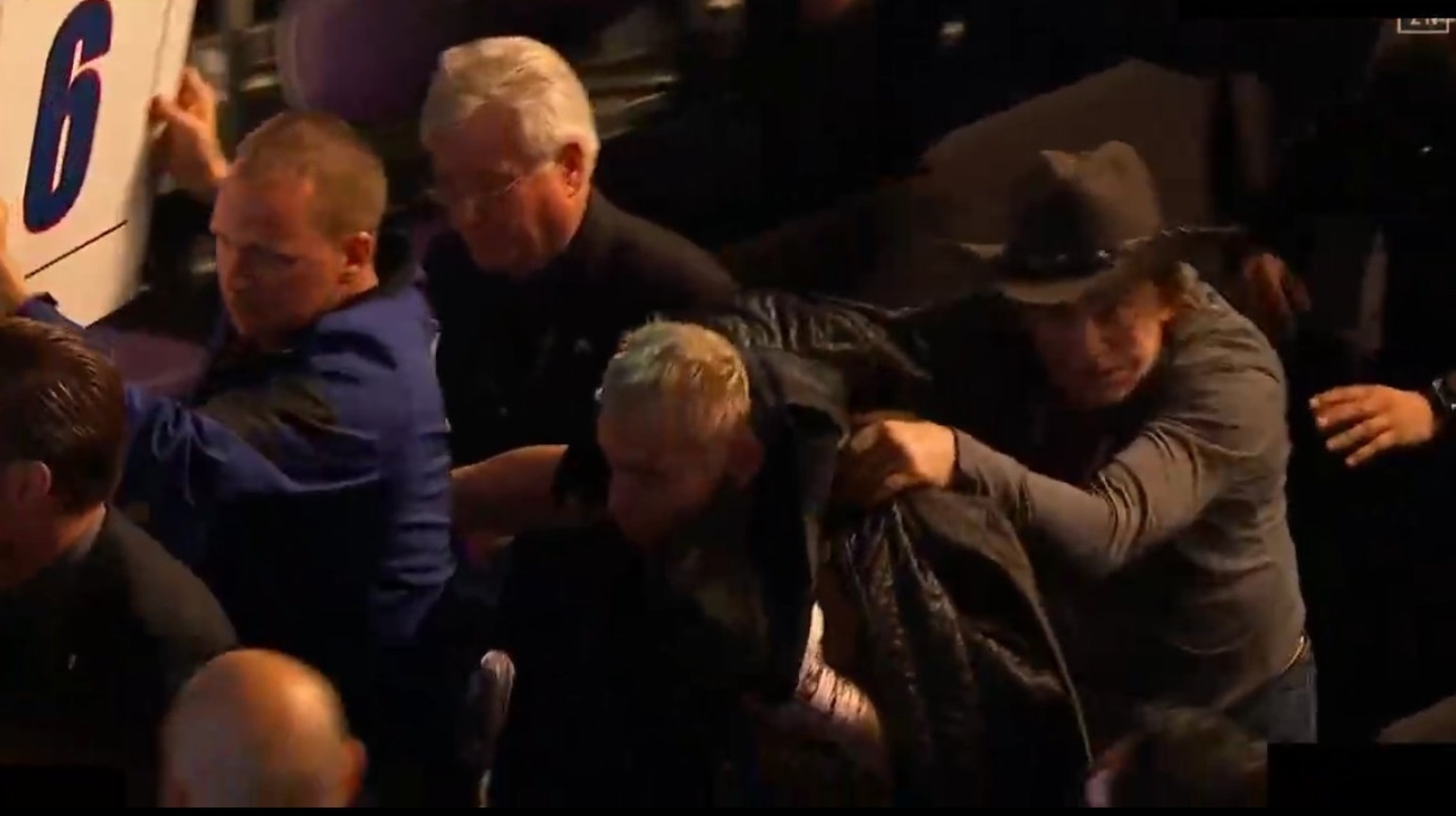 PHOTO Mickey Rourke Trying To Shield Julio Cesar Chavez Jr From Objects Being Thrown At Him