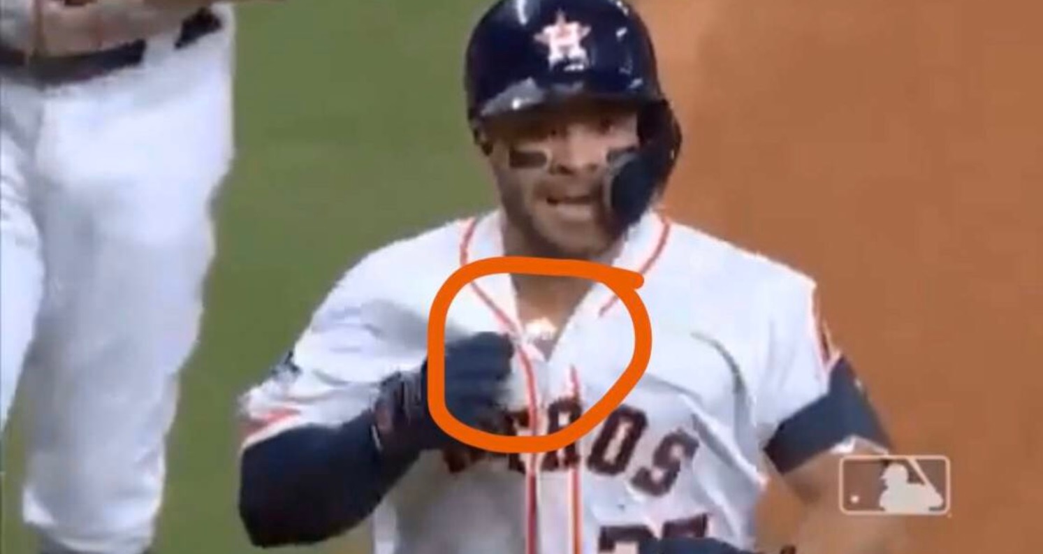 Close Up Photo Of Buzzer Falling Out Of Jose Altuve's Shirt Proving He Cheated