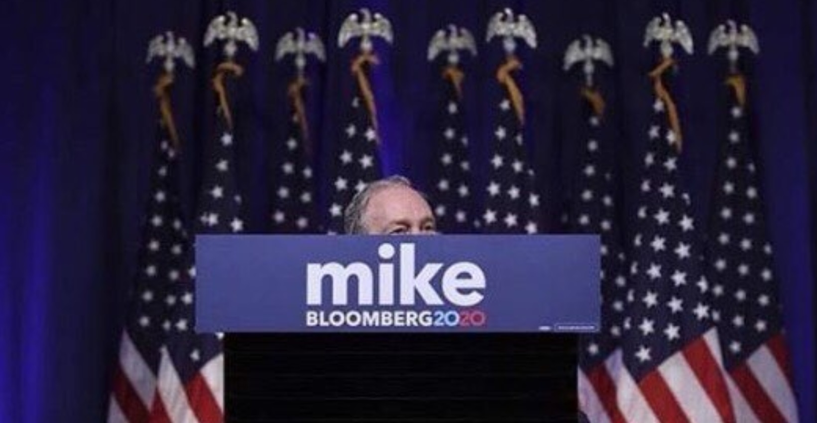 PHOTO Mike Bloomberg Too Short To See Over Podium
