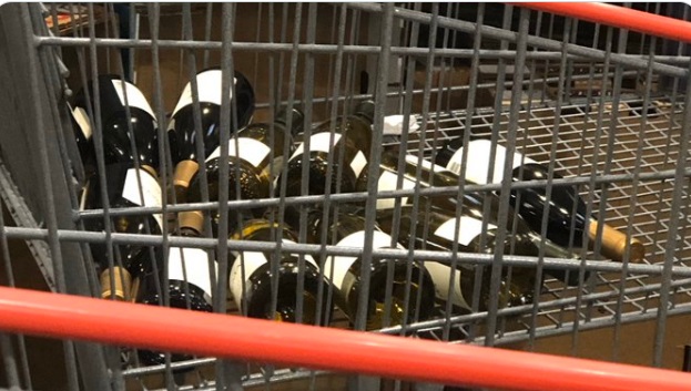 PHOTO Dude In Washington State Costco Just Buys Dozens Of Bottles Of Wine To Prepare For Corona Virus Craziness