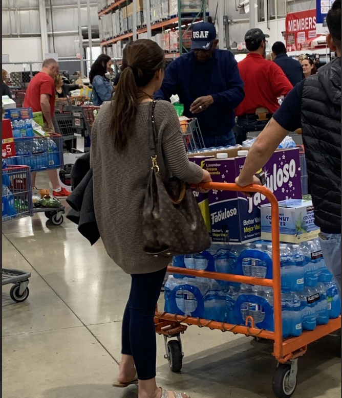 PHOTO Lady Hoards Bottled Water For Her Family Buys 15 Cases At San Antonio Costco Over Corona Virus Fears
