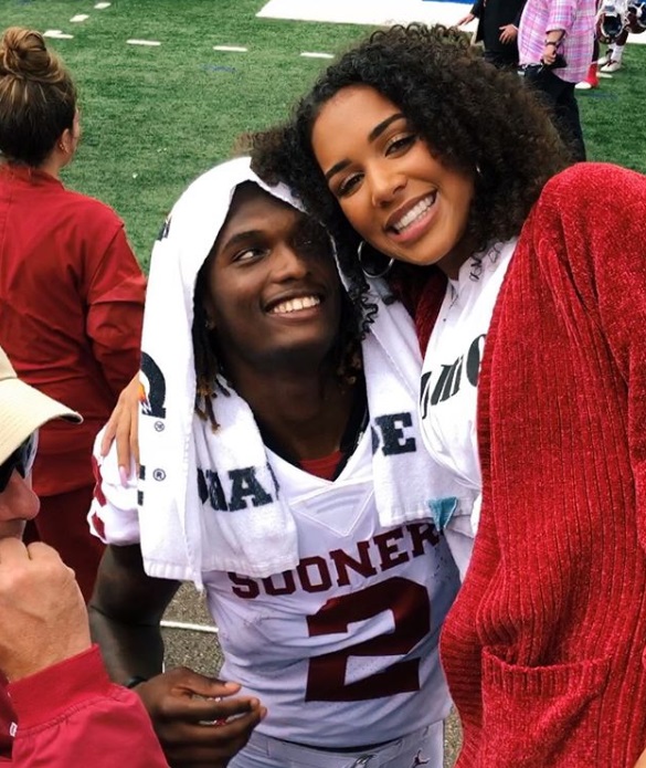 PHOTO CeeDee Lamb Side Eyeing Girlfriend On Sooners Sideline In OU Jersey Before She Became A Gold Digger