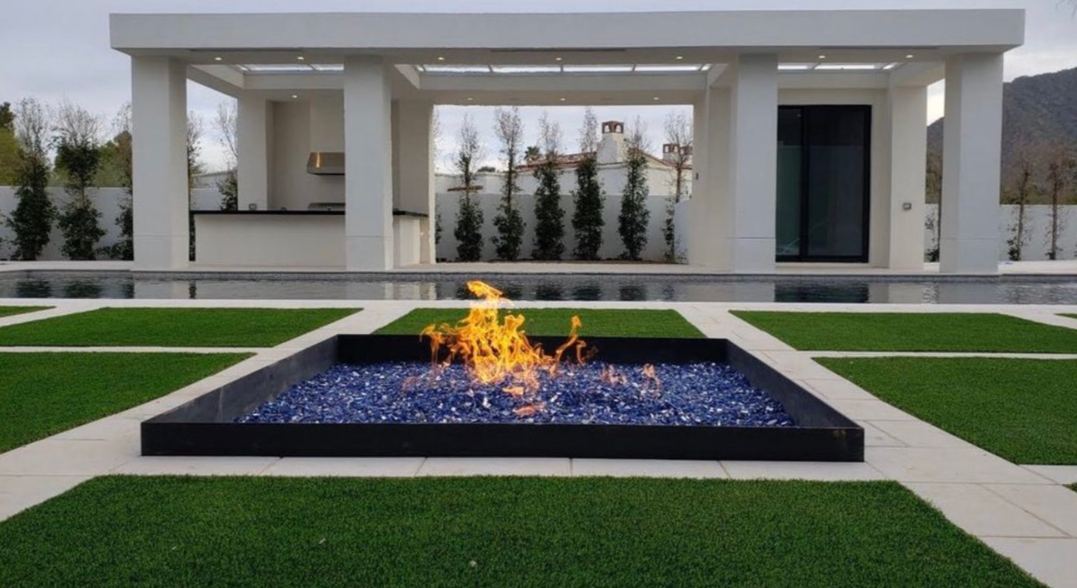 PHOTO Close Up Of Charcoal Fire Pit That's Always On In Kliff Kingbury's Backyard