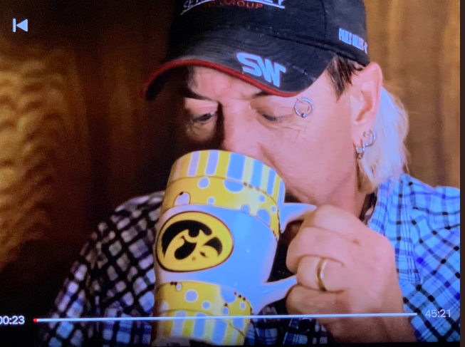 PHOTO Joe Exotic Drinking Out Of An Iowa Hawkeyes Coffee Mug