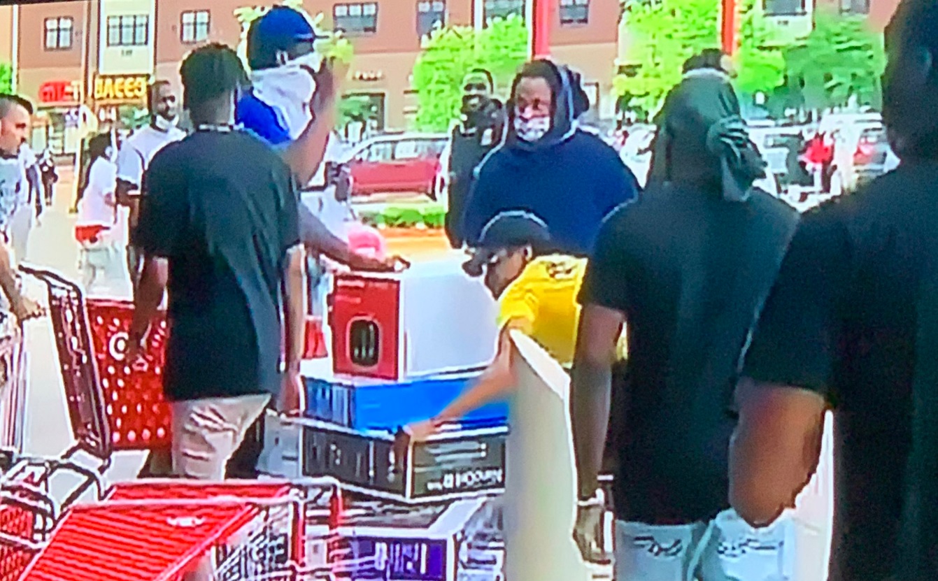 PHOTO Dude Struggling To Loot Three 50 Inch TV's And A Smart Speaker From Target In Minneapolis During George Floyd Protests