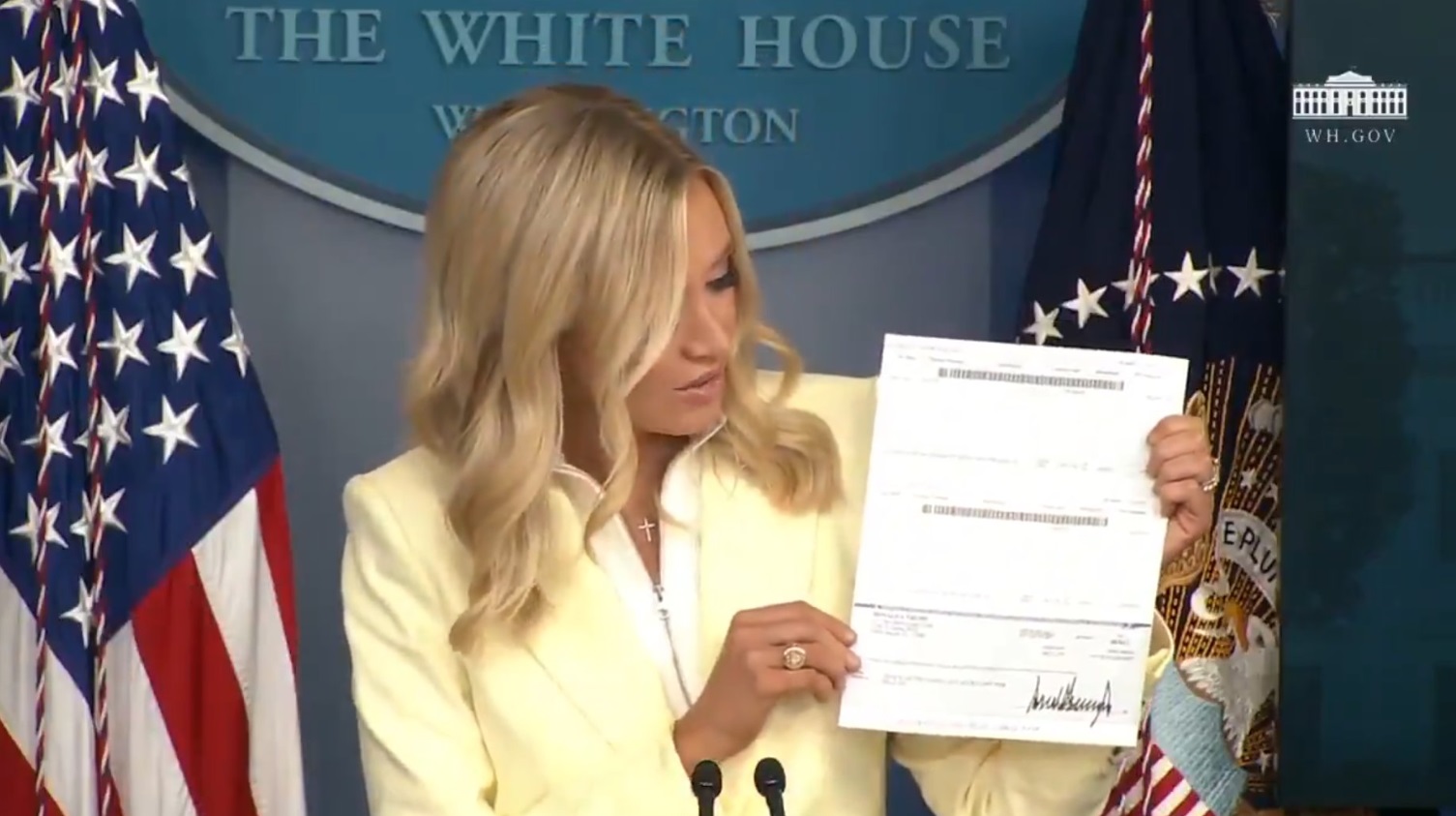 PHOTO Kayleigh McEnany Holding A Donation Check From Donald Trump's Salary