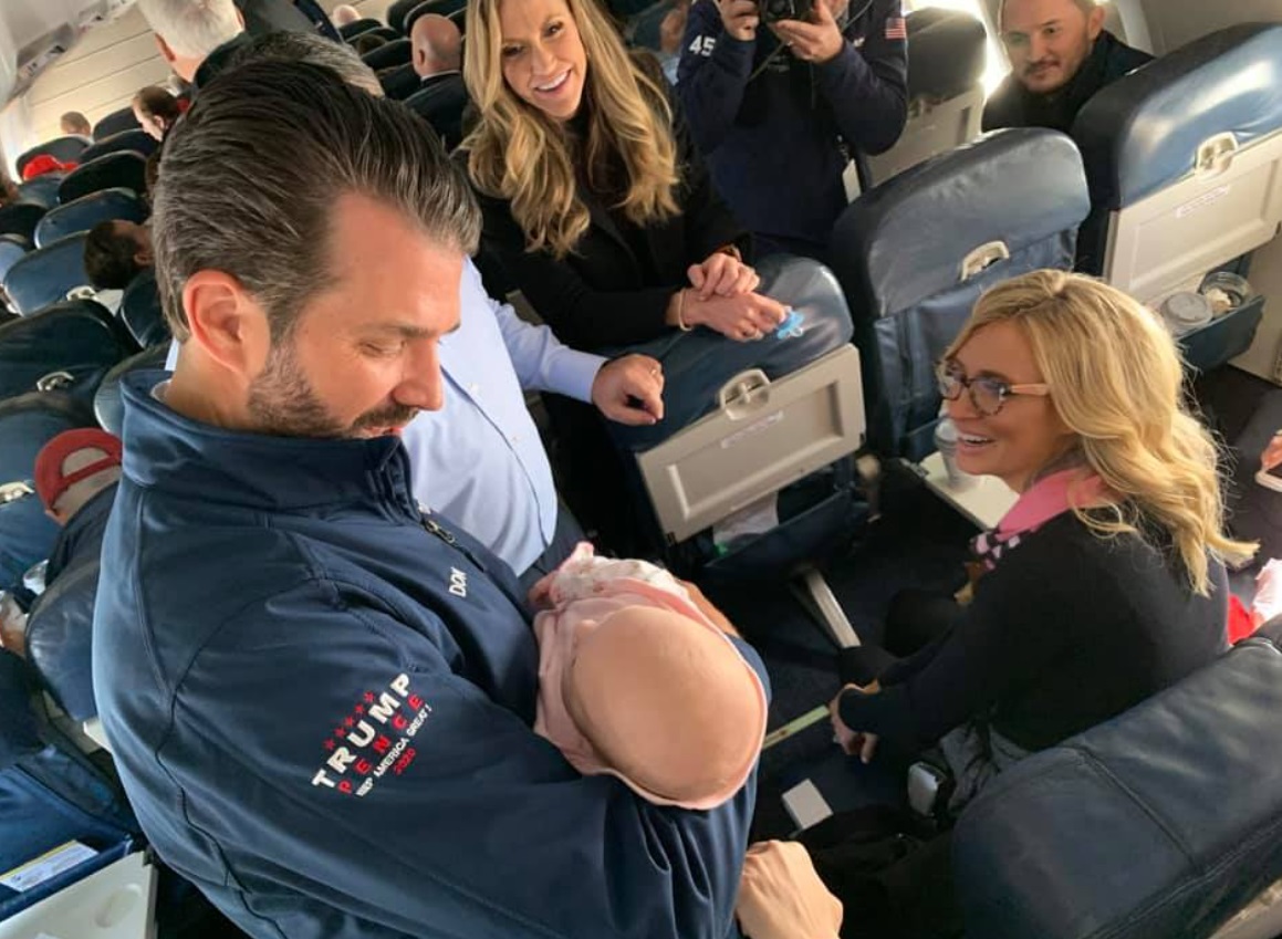 PHOTO Kayleigh McEnany Wearing Glasses While Donald Trump Jr Holds Her Baby