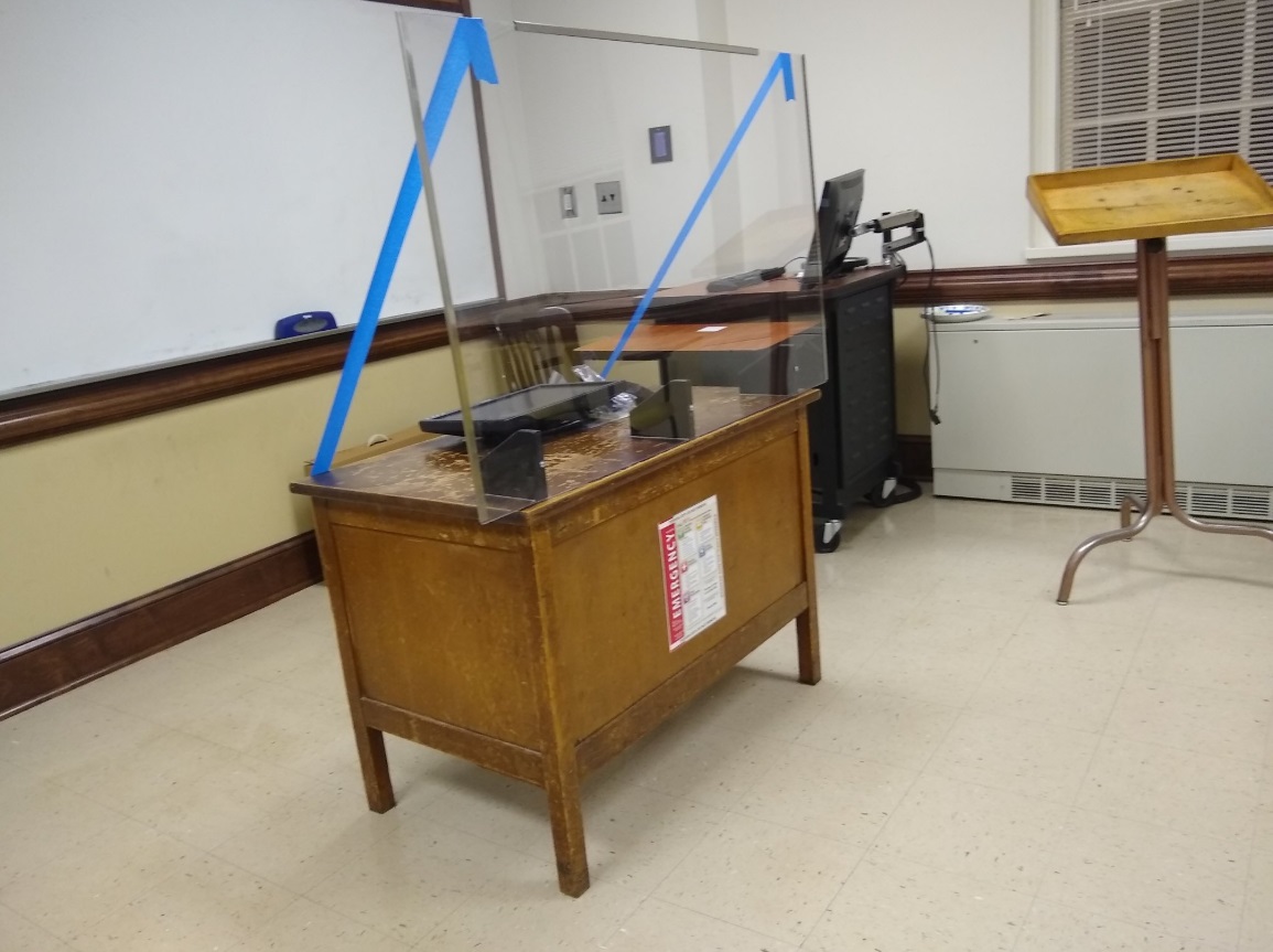 PHOTO University Of Georgia Setup Barrier In Classroom By Taping Piece Of Glass To Professor's Desk